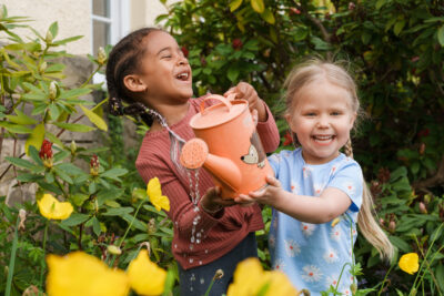 nursery children with watering can