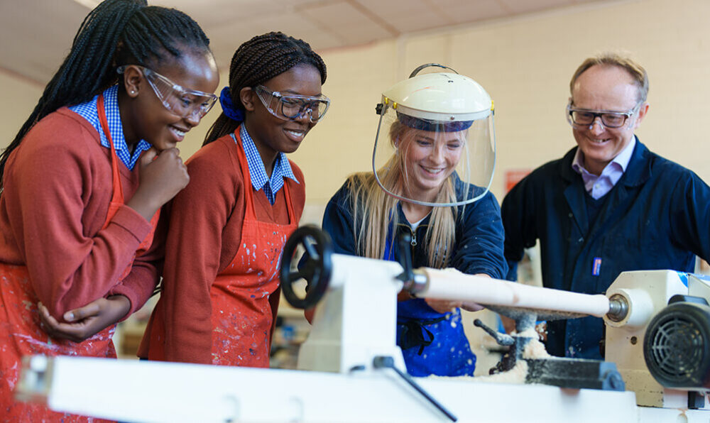 Woodwork class girls teacher school